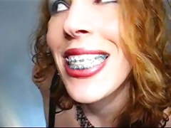 Redhead with braces in a latex dress 3